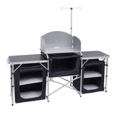 Nice C camping kitchen table with light stand and windshield for wind-free cooking