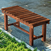 Nidouillet outdoor backless bench with cedar slats for two-person seating