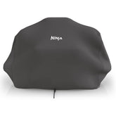 Ninja Woodfire Premium Cover side view protects OG700 grill from rain and sun.