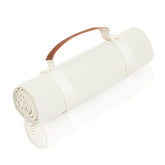 NOONOOJOOJOO white picnic blanket folded for easy transport and quick setup outdoors.
