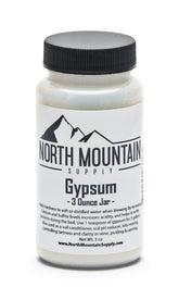 North Mountain Supply gypsum 3 oz jar on countertop, enhances brewing water hardness for better flavor.