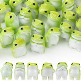 Novabright frog smiling secretly figurine adds charm to desks and shelves.