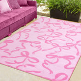 Nuanchu pink bow outdoor rug 5x8 ft offers soft barefoot comfort for patios and decks.