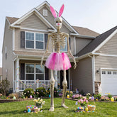 OceanCamel pink tutu skirt on a 12ft skeleton enhances visibility for festive curb appeal.