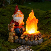 O-FarFarm solar light-up garden gnome statue illuminating the yard at night