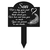 OOOCT memorial grave stake with heart and feather plaque outdoors for remembrance