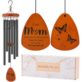 Oprever wind chime with butterfly design enhances garden serenity.