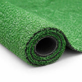 Ottomanson artificial grass turf with drainage holes for all-weather patio use.