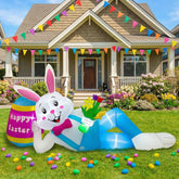 OurWarm 8ft Easter bunny lounging in blue outfit with a pink tie, inviting festive photos.