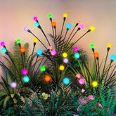 PATIOPIA solar garden lights with firefly glow lighting the yard at dusk