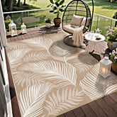 Pauwer leaf-pattern brown outdoor rug enhances patio decor and comfort.