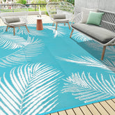 Pauwer outdoor rug leaf teal top view highlighting durable waterproof surface
