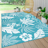 Pauwer waterproof outdoor rug front view with reversible floral teal design for versatile patio decor.