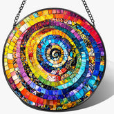 Pauyadu rainbow spiral stained glass suncatcher lighting up windows with colorful reflections.