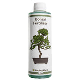 Perfect Plants Liquid Bonsai Fertilizer bottle pour enhances uptake for healthier foliage.