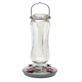 Perky-Pet Starglow vintage glass feeder bottle enhances outdoor decor while attracting hummingbirds.