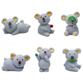 Pinenjoy koala figurine climbing a tree, ideal for fairy gardens