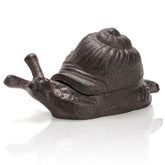 Pumtus snail key hider outdoors in a garden hides a spare key securely