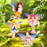 QKDS blue sitting fairy decorates a plant pot with playful charm.