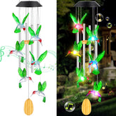 QUNPON solar hummingbird wind chime enhances outdoor ambiance with gentle light.