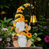 QZZP Solar Bee Gnome Lantern lights garden paths with warm, energy-saving glow.