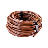 Raindrip R283DT dripline with 12-inch emitter spacing for even moisture across garden beds