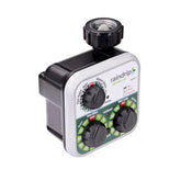 Raindrip R675CT timer mounted on outdoor faucet for reliable drip irrigation control