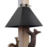 RELIY metal squirrel baffle over a 4x4 post protects bird feeders from intruders