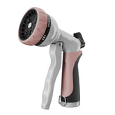 Restmo garden hose nozzle front view in rose gold with ergonomic grip for easy watering.