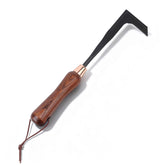 Restmo heavy-duty crack weeder tool in action removing weeds from patio joints.