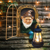 REYISO gnomes statue with solar lights brightens the fairy garden at night.
