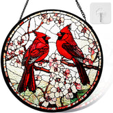 Riletese cardinal stained glass sun catcher graces a sunny window with vibrant color and life.