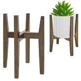 Rnined plant stand indoor with walnut finish highlighting mid-century charm