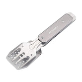 Roxon 4 in 1 mini folding BBQ tool spatula in action for outdoor grilling