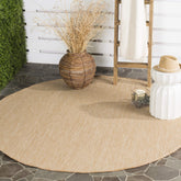 Safavieh Courtyard round outdoor rug in natural-cream tone enhances patio durability and style.