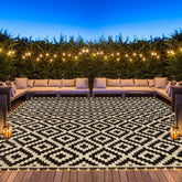 SAND MINE reversible mats with LED lights glow on a patio at dusk