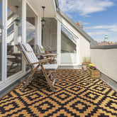 Sand MINE waterproof outdoor rug in black-brown lattice for patios and decks.