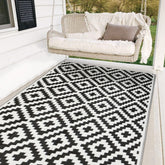 SAND MINE waterproof outdoor rug 5x8 laid on a sunlit patio for clean outdoor living.