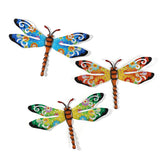 Scwhousi dragonfly metal wall decor on a patio adds vibrant outdoor art.