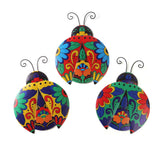 Scwhousi metal ladybugs wall decor adds vibrant talavera color to outdoor walls.