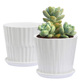 Sietpoek cylinder ceramic pot with attached saucer demonstrating integrated drainage