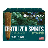 SimplyGro fertilizer spike being inserted at the root zone for evergreen feeding.