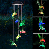 Six Foxes wind chime with colorful lights brightens outdoor spaces at night.