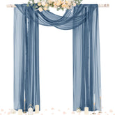 Socomi dusty blue sheer arch drape panel creates soft romantic backdrop for ceremonies