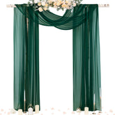 Socomi emerald green sheer arch drape over ceremony arch for elegant backdrop