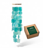 Solange & Frances wind chimes on porch with capiz shells creating soothing outdoor ambiance