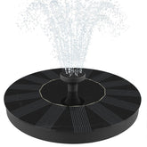 Solatec solar fountain pump on water surface adds gentle movement to ponds and bird baths.
