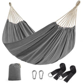 Songmics double hammock setup on a terrace for easy outdoor lounging.
