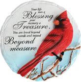 Spoontiques cardinal stepping stone in garden adds a welcoming touch.