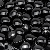 Stanbroil onyx black luster fire glass drops in a fireplace create shimmering glow